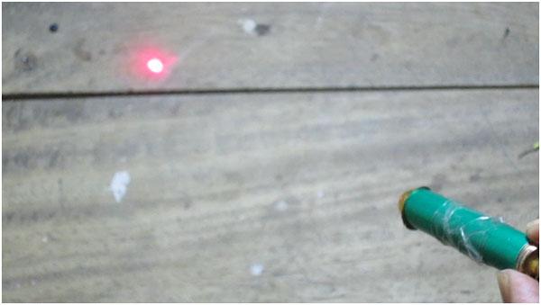 Image of Laser Pointer pointing Laser Light to a Target Image of Laser Pointer pointing Laser Light to a Target