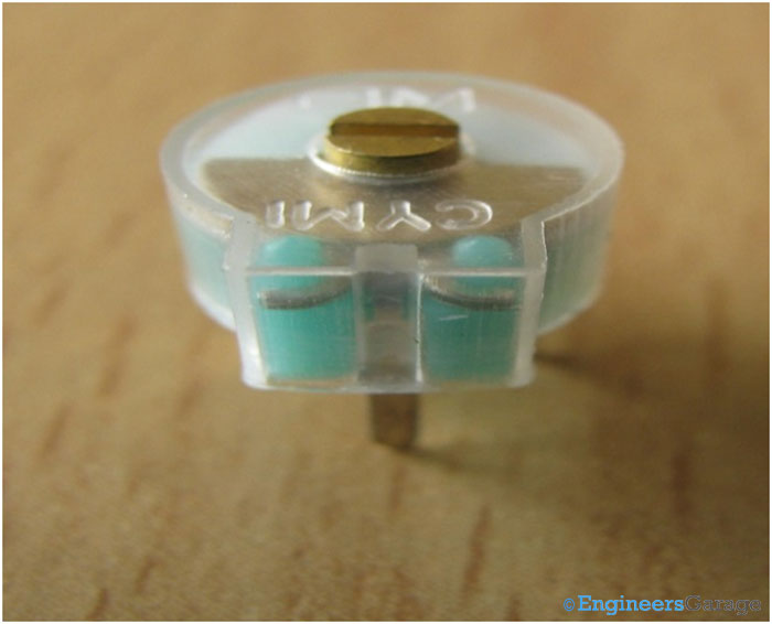 Image Showing Screw Attached To Grooves In Capacitor Image Showing Screw Attached To Grooves In Capacitor