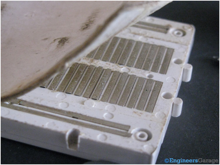 Back View—Bread Board With Thick Cover Removed Showing Metal Clips Back View—Bread Board With Thick Cover Removed Showing Metal Clips