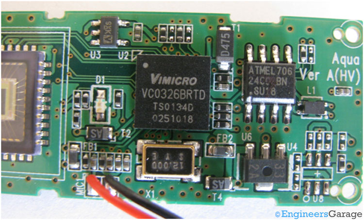 The integrated circuit (IC) and electronic circuitry of the webcam's PCB.