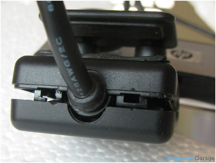 Image Indicating Hooks that Bind Together Front and Back of Webcam Image Indicating Hooks that Bind Together Front and Back of Webcam