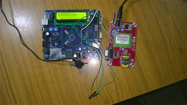 Image of LPC2148 ARM Microcontroller and GSM Module based Overheating Alert System displaying alert message