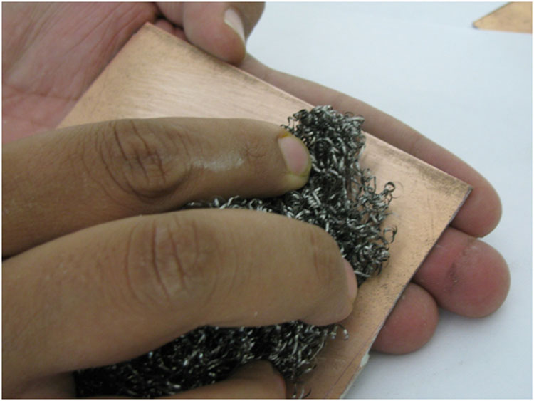 Image showing copper side of PCB rubbed by steel wool Image showing copper side of PCB rubbed by steel wool