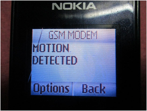 Image showing message received on a mobile phone on detection of an intruder