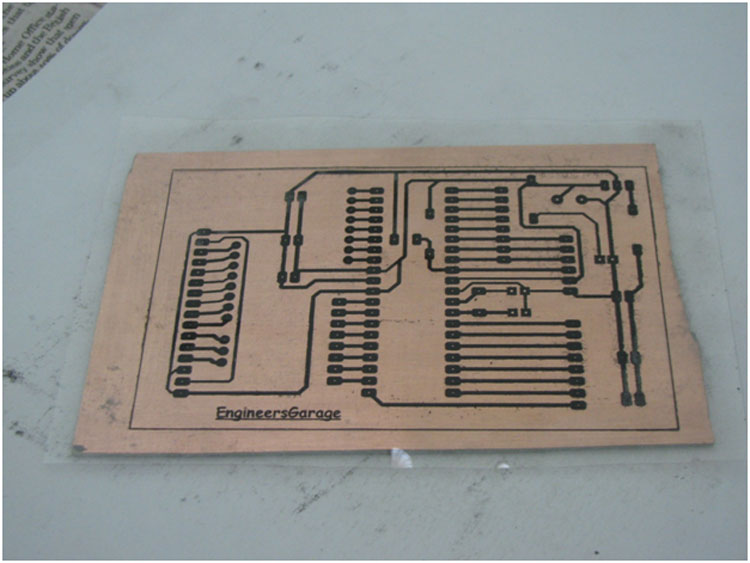 Image showing OHP sheet iron pressed on copper side of PCB Image showing OHP sheet iron pressed on copper side of PCB