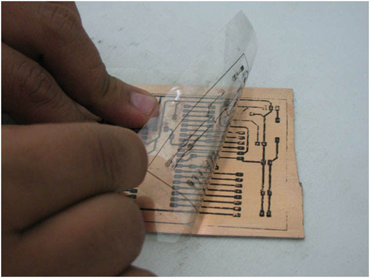 Image showing removal of OHP sheet from PCB Image showing removal of OHP sheet from PCB