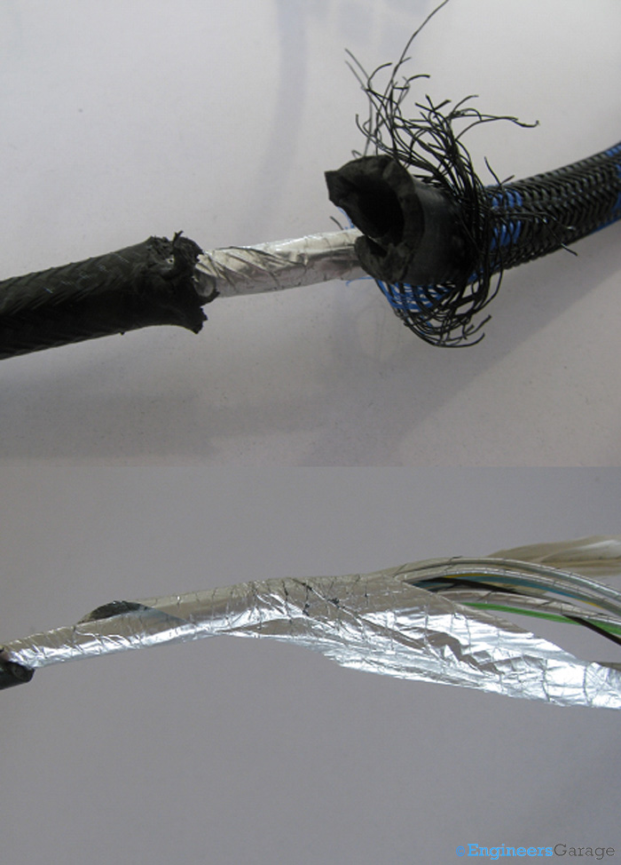 Image of Thick Plastic Covering and Aluminium Mylar Layer Under which Copper Wires of HDMI Cable Lie Image of Thick Plastic Covering and Aluminium Mylar Layer Under which Copper Wires of HDMI Cable Lie