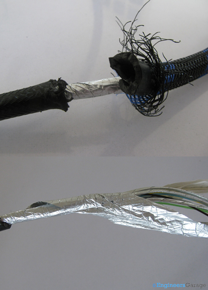 Image of Thick Plastic Covering and Aluminium Mylar Layer Under which Copper Wires of HDMI Cable Lie