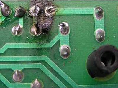 Excessive heat damages a circuit board trace 