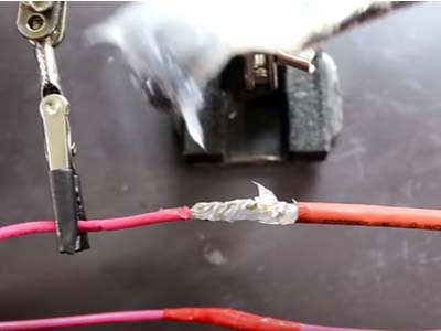 Covering the soldered joint with heat shrink tube to make it stable 